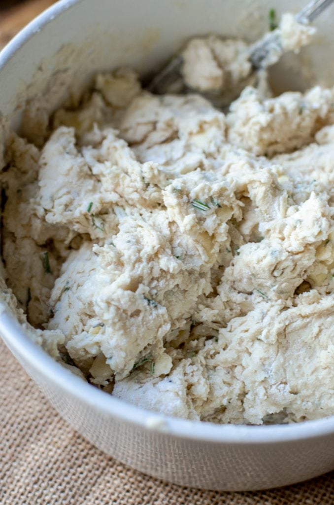 Rosemary dumpling dough mixed in a bowl.