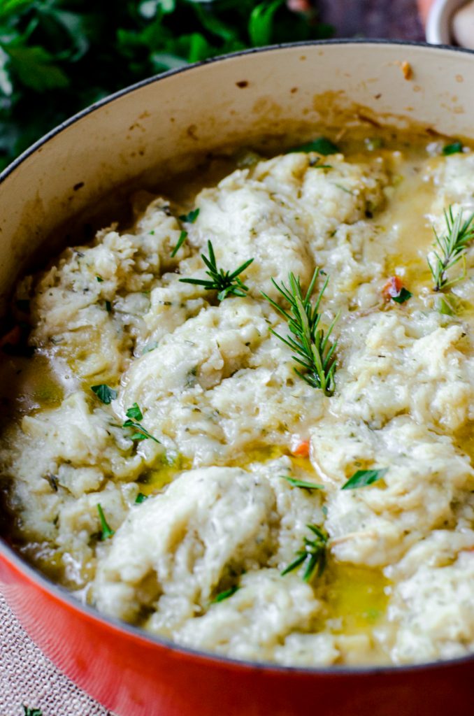 Cooked dumplings on top of soup.