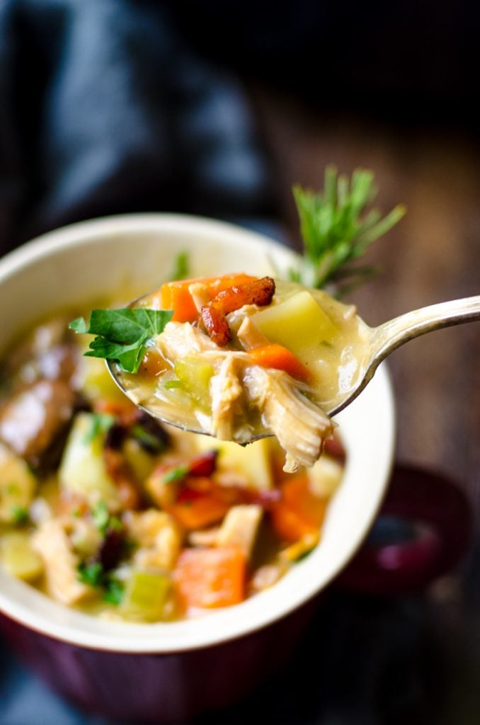 Closeup of a spoon of soup.