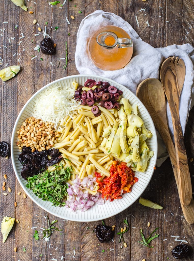 Overhead view of the different colors of ingredients for pasta salad.