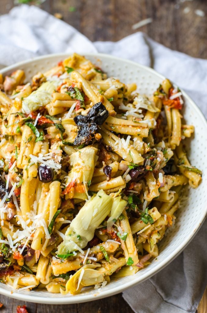 A bowl of sun dried tomato pasta salad with California Prunes.