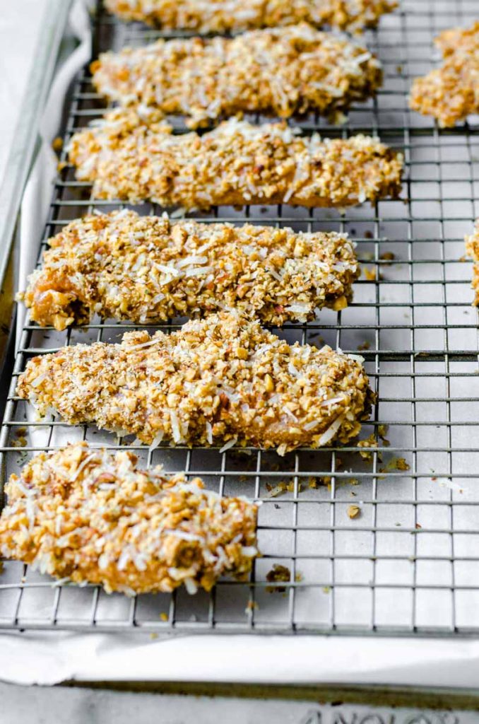 Cooked almond flour chicken on a baking rack.