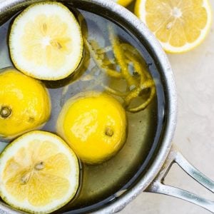 A pot of lemons and zest making simple syrup.