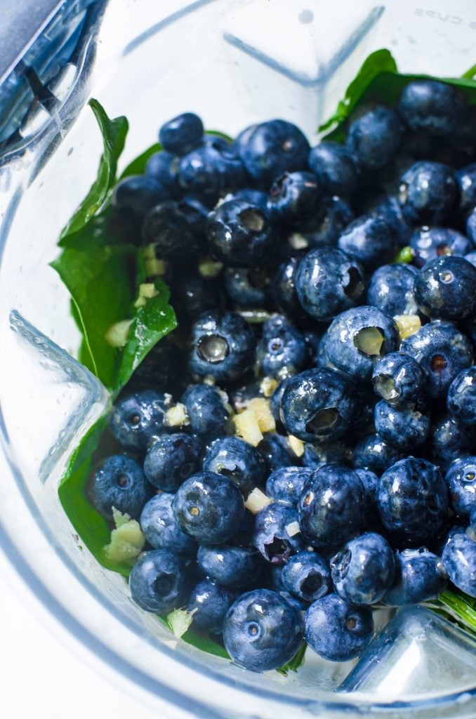 Blueberries ginger in a blender.