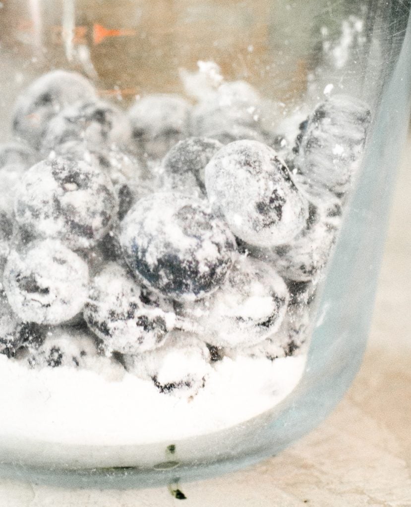 Blueberries coated in flour so they won't sink in muffin mix.