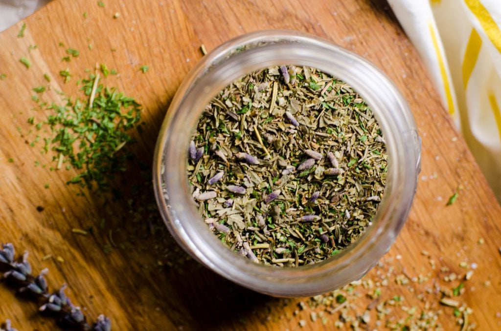 Overhead view into a spice jar of herbs de provence.