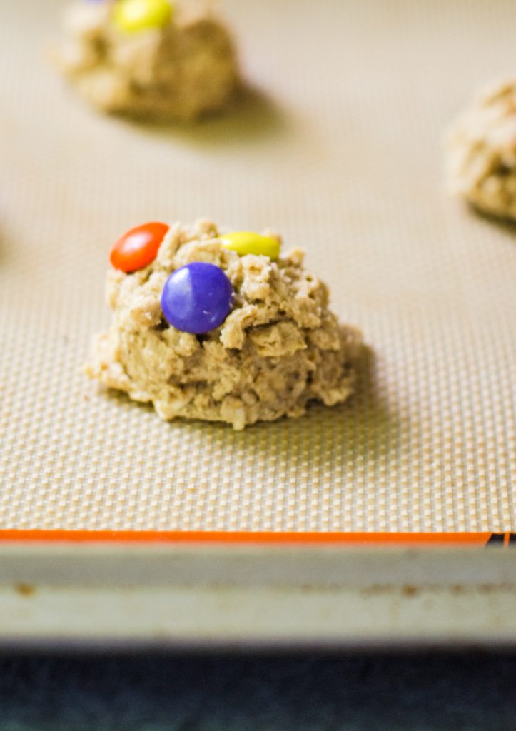 Colored candy coated gems in cookie dough.