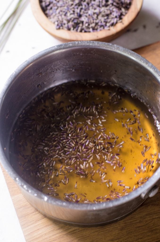 Honey lavender simple syrup after being mixed in a pot.