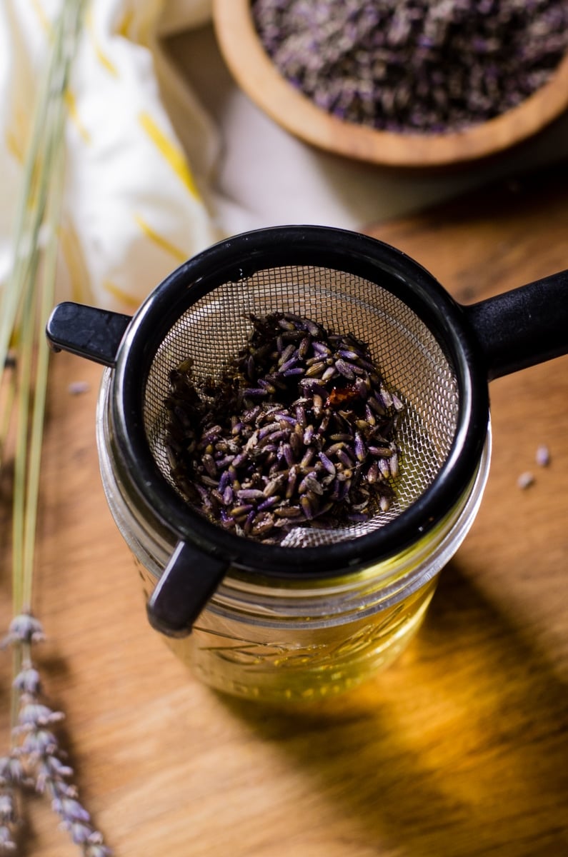 A fine mesh strainer filled with dried lavender.