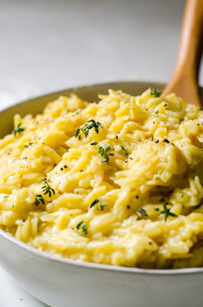 Close up of fresh thyme garnish on pasta.