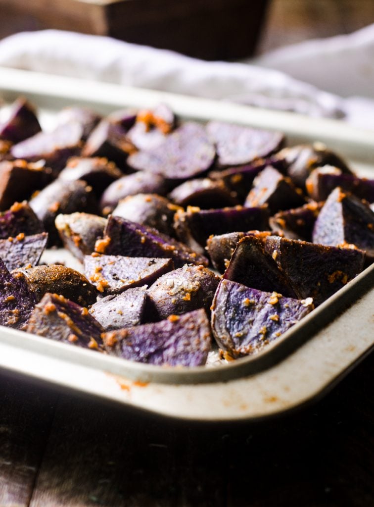 A sheet pan of cooked roasted potatoes.