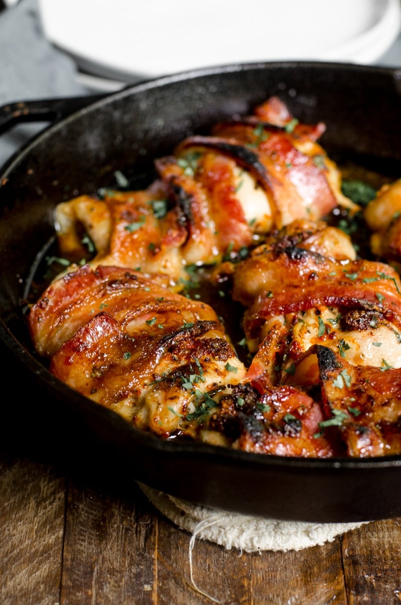 Cooked bacon wrapped chicken thighs in cast iron.