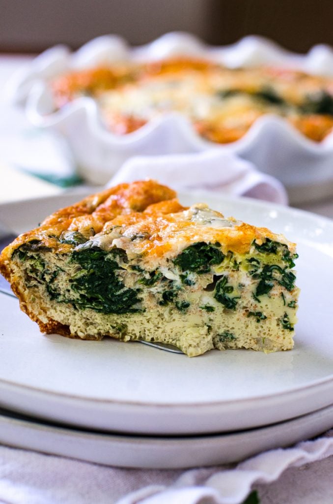 Close up of a slice of spinach egg bake.