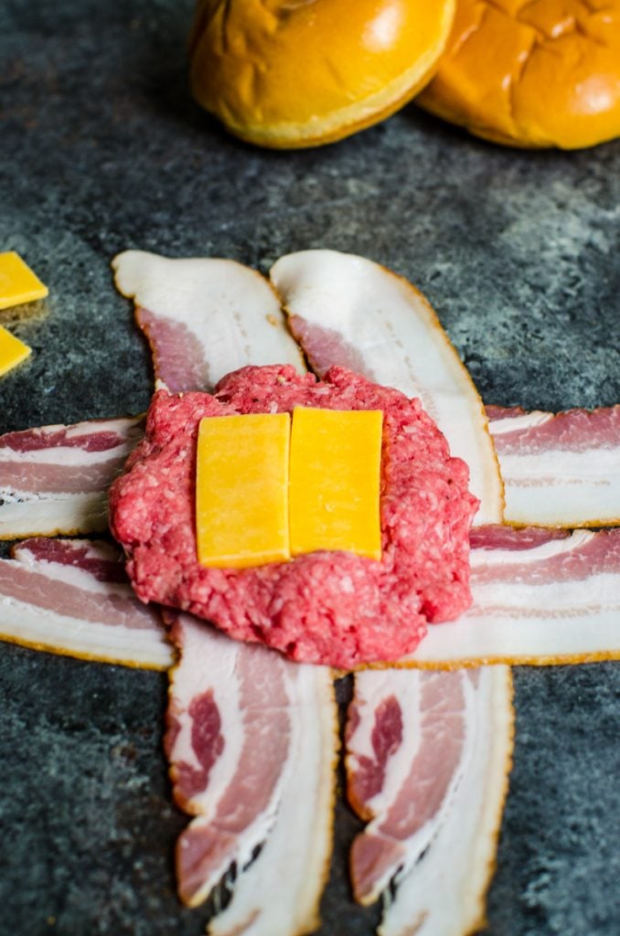 how to stuff cheese inside of a bacon wrapped burger.