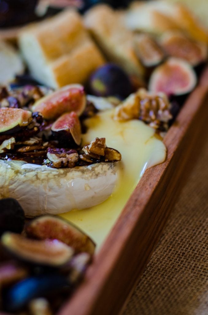 Oozing brie coming out a baked wheel.