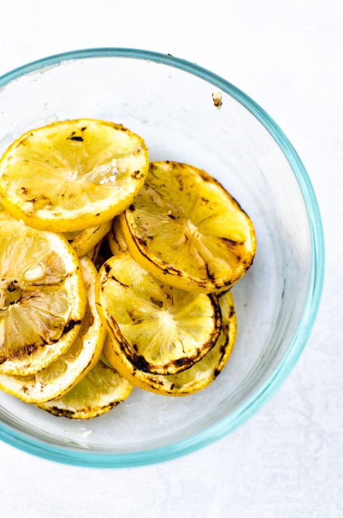 A bowl of grilled lemons.