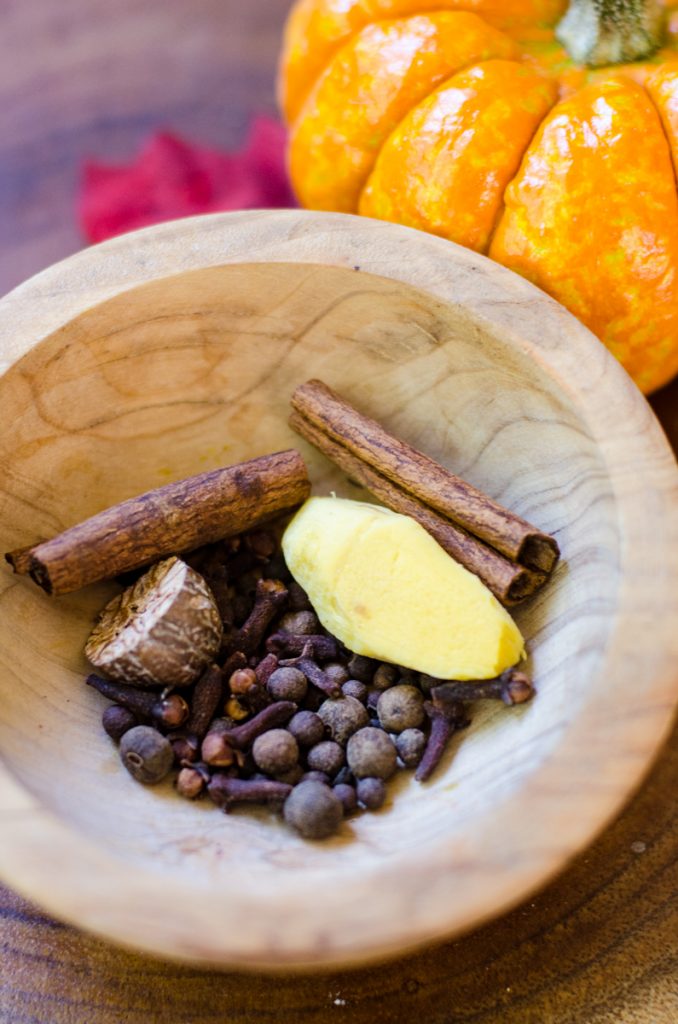 A bowl of whole pumpkin spices.