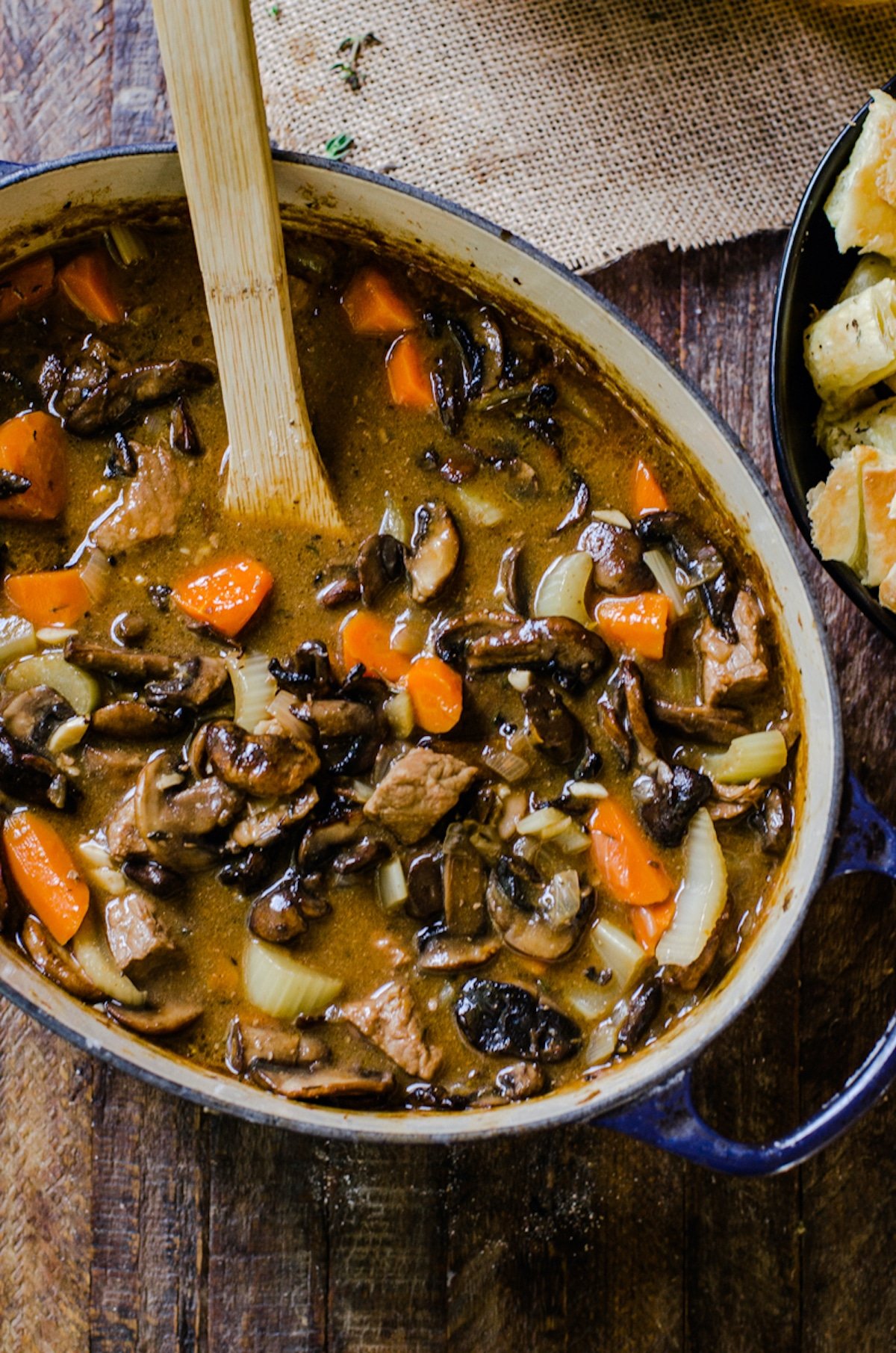 Overhead view into a pot of steak and ale soup.