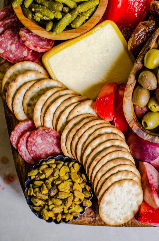 Close up of crackers on a cheese board looking fluid with movement.