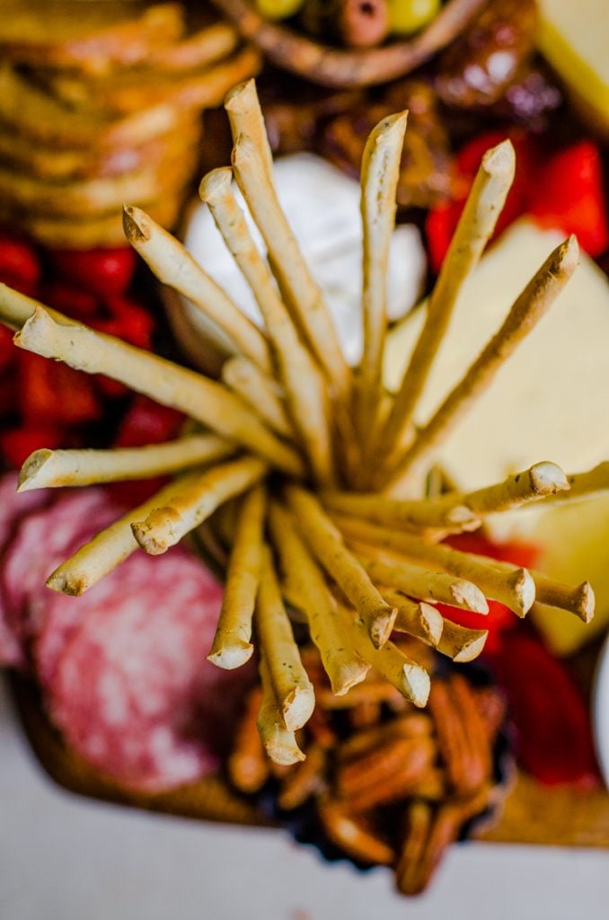 Looking into a jar of breadsticks from overhead.