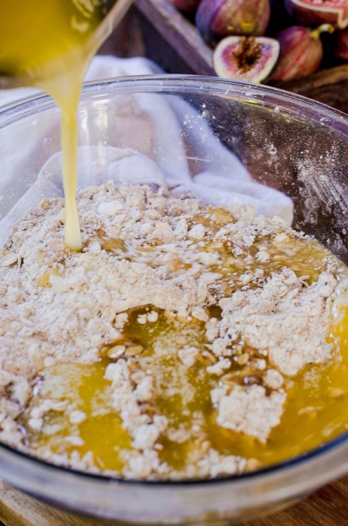 Butter pouring into crust dough.