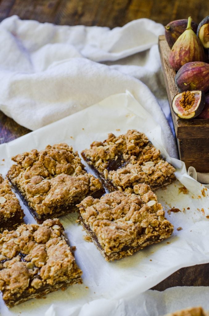 Cut homemade fig newtons bars on a piece of parchment paper.