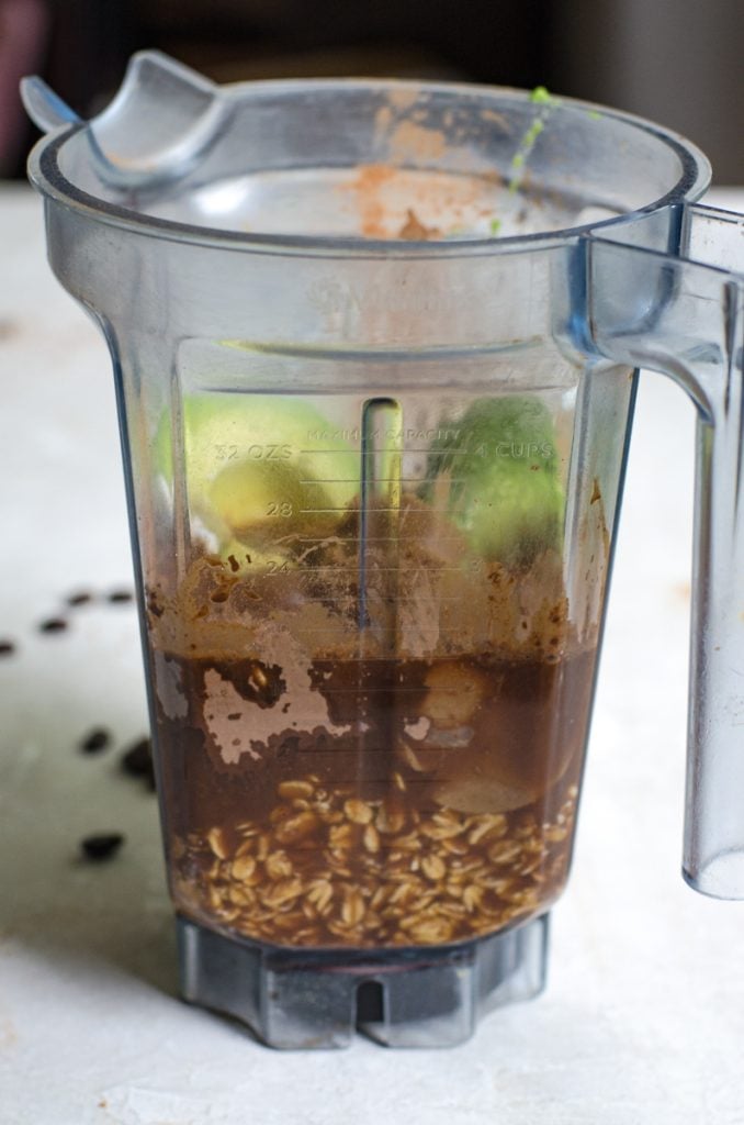 A blender filled with ingredients for making a smoothie.