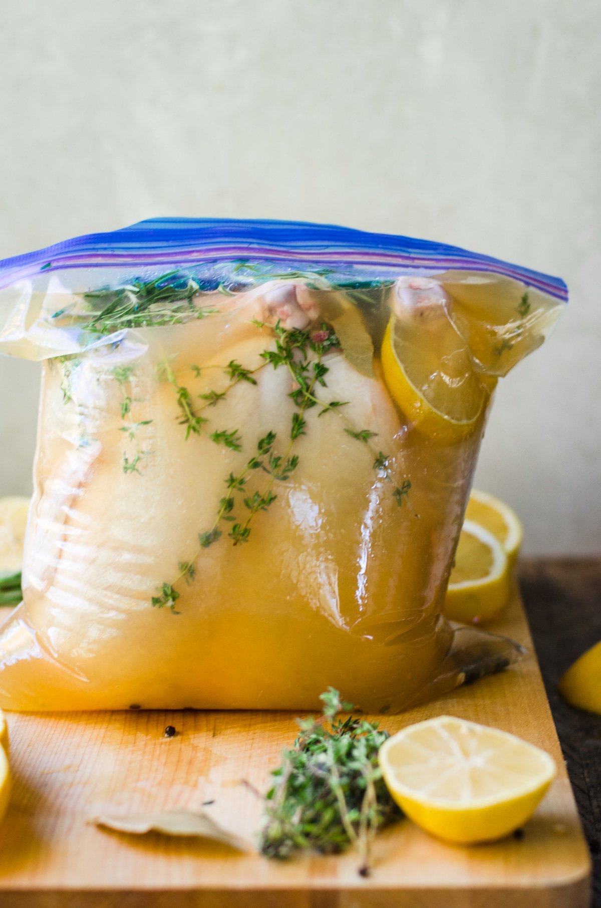Chicken brining in apple juice and herbs.