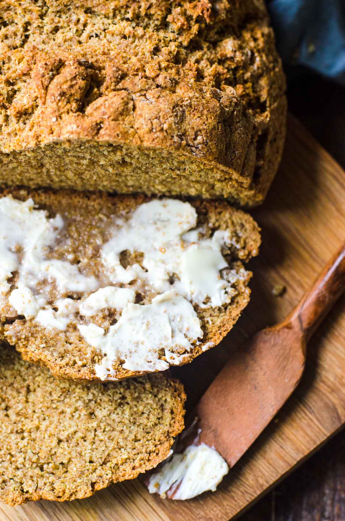 Butter melting on a slice of soda bread just cut from the loaf.