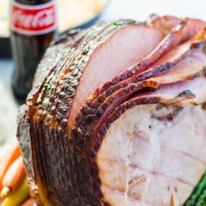 Slices of coke ham coming away from the whole ham.