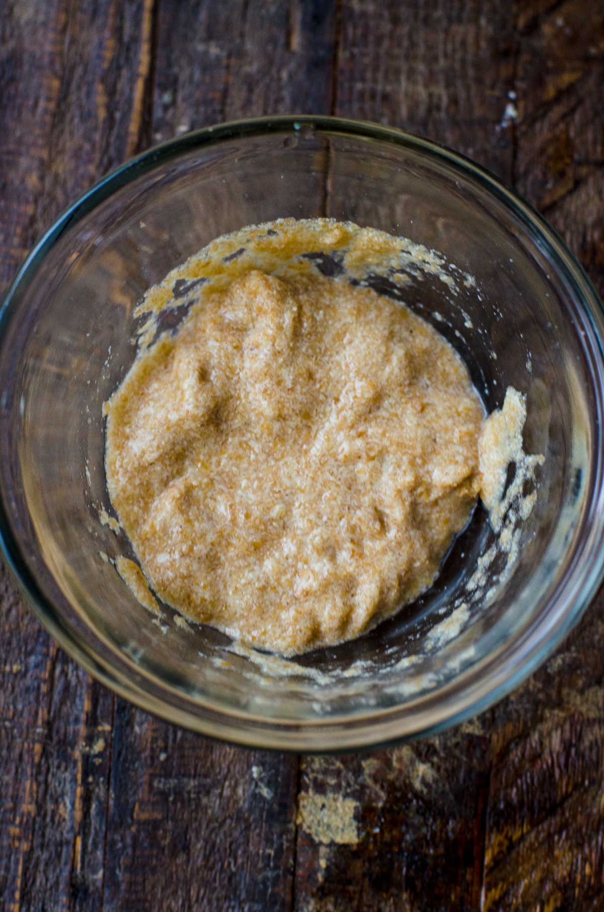 Overhead view into a bowl of flaxseed meal to use instead of eggs.