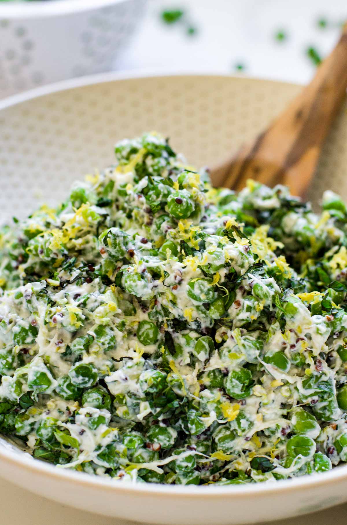 Close up of peas and lemon in a salad.