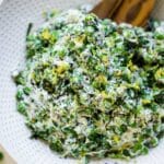 English pea salad mixed with ricotta and lemon in a bowl.