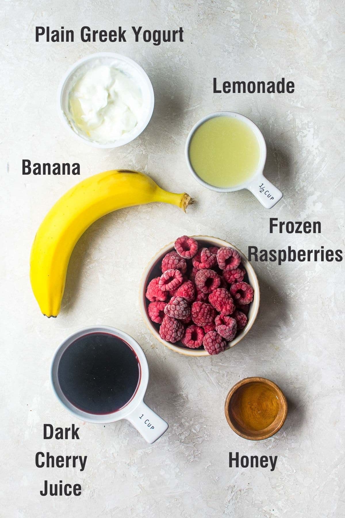 Ingredients for making raspberry smoothie labeled.
