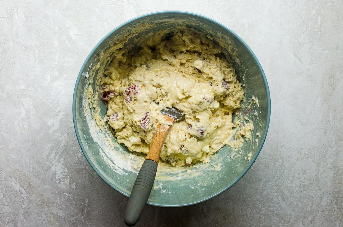 Raspberry white chocolate muffin batter folded together.