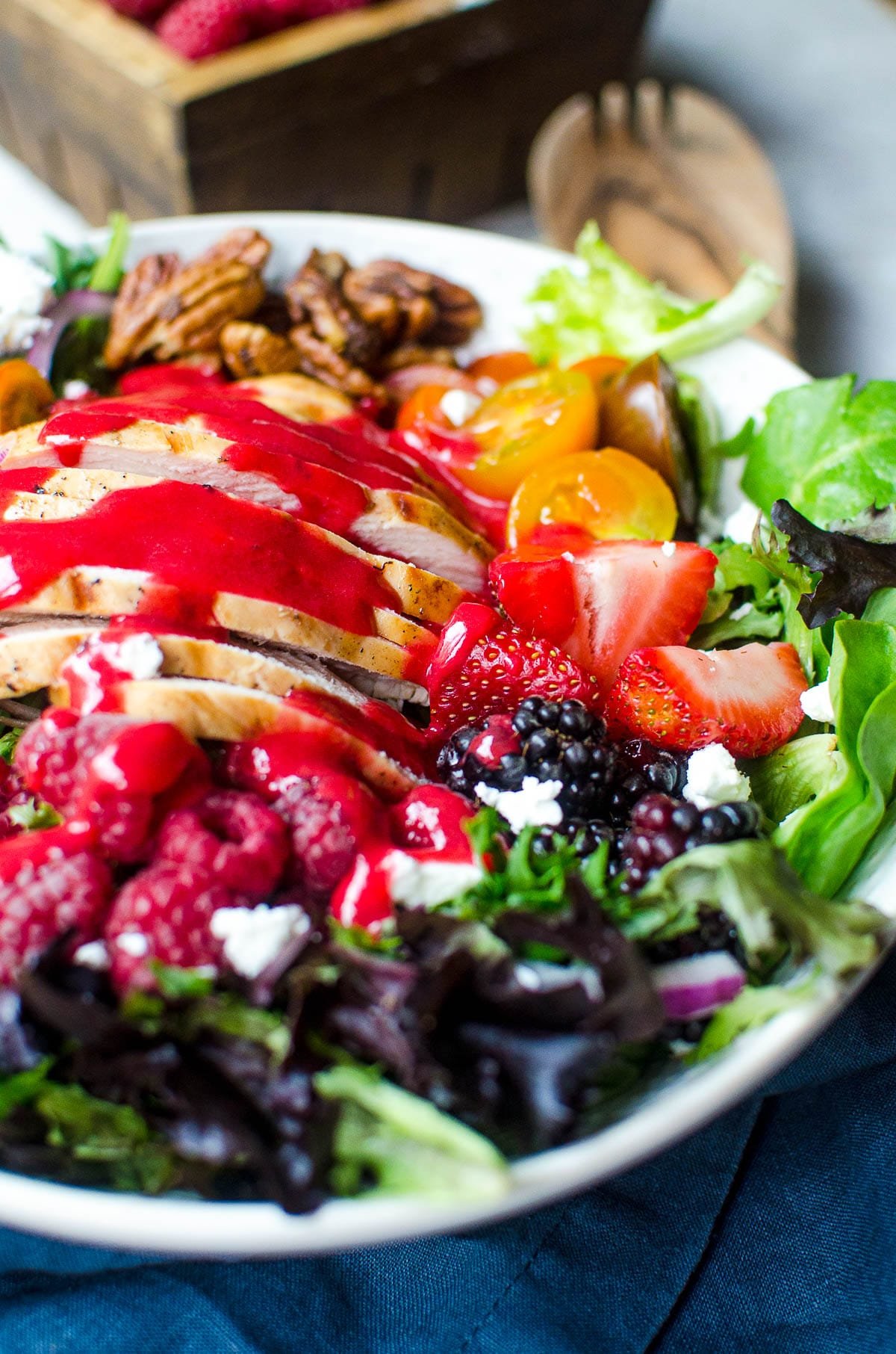 Raspberry vinaigrette drizzled on a summer salad.