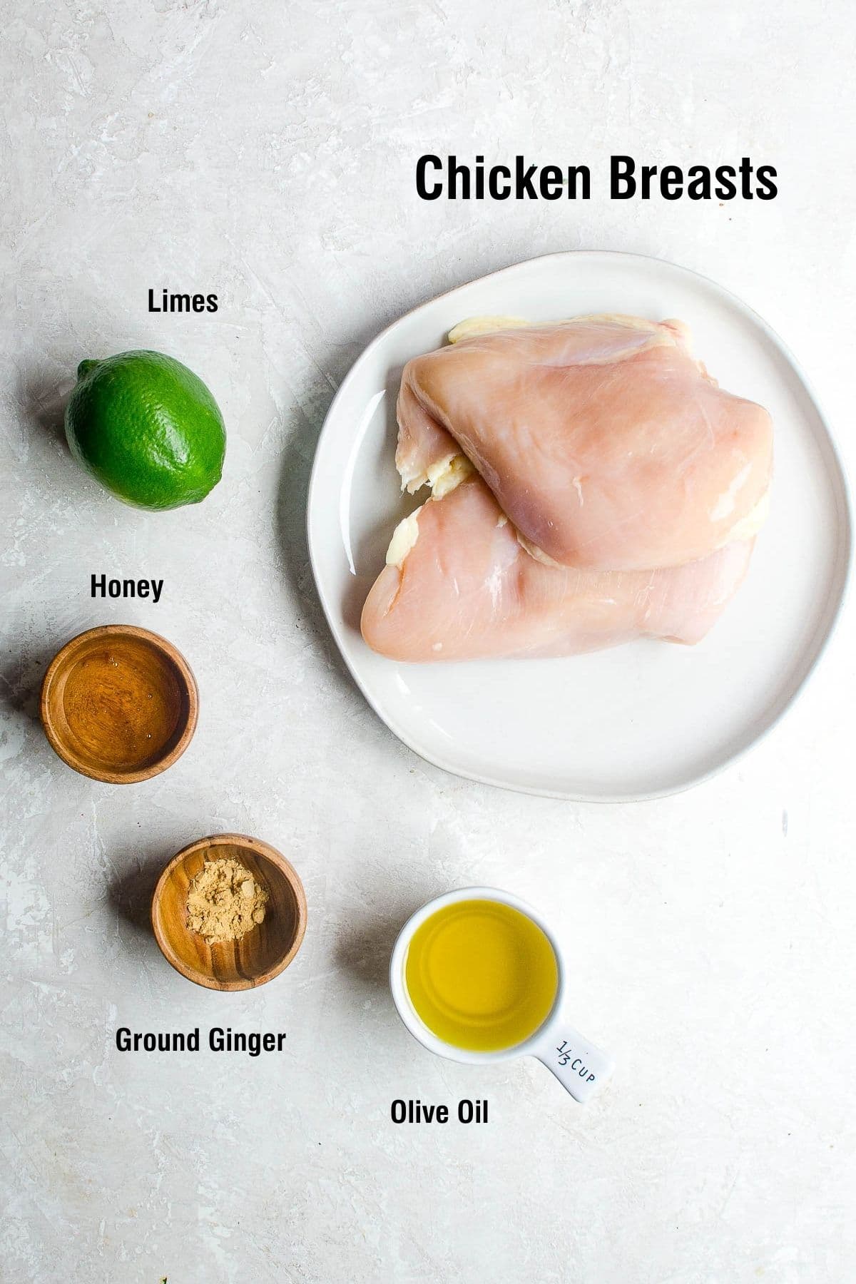 Labeled ingredients for a honey ginger lime grilled chicken marinade. 